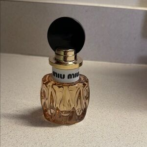 Miu Miu Fragrance Bottle with Black Cap and Gold Accents